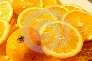 yellow lemons on a plate on a sunny day photo