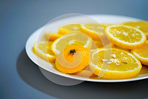 yellow lemons on a plate on a sunny day photo