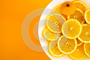 yellow lemons on a plate on a sunny day photo