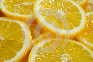 yellow lemons on a plate on a sunny day photo