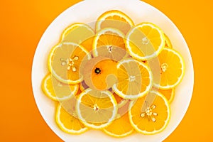 yellow lemons on a plate on a sunny day photo