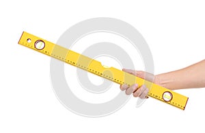Yellow level tool in hand.