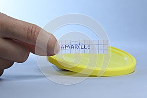 Yellow lid with small blank note. Amarillo the Spanish word for yellow photo