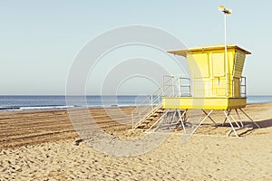 Yellow lifeguard station on the beach