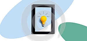 Yellow light bulb inside a frame - inspiration, creativity themes