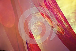 Yellow light on the red plastic.