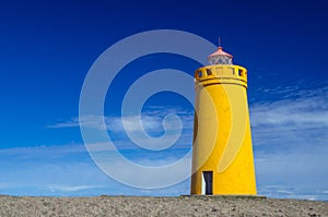 Yellow lighthouse and clear blue sky