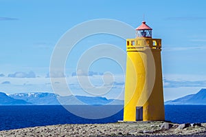 Yellow lighthouse and on a clear and sunny day