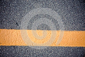 yellow line on asphalt background texture