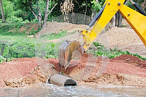 Yellow Loader Backhoes working