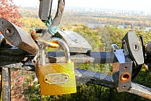 A yellow lock as a symbol of endless love and devotion on the background of noble city, Kiev.