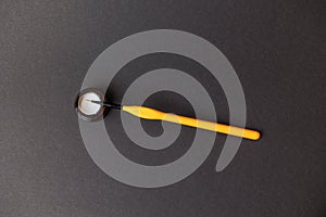 Yellow lubing brush with white lube, isolated