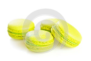 Yellow macaroons isolated on white, selective focus