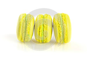 Yellow macaroons isolated on white, selective focus