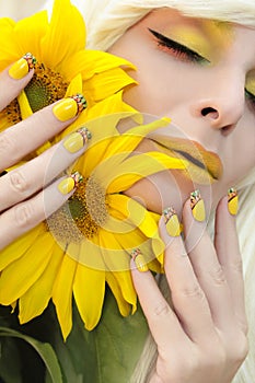 Yellow makeup and French manicure.