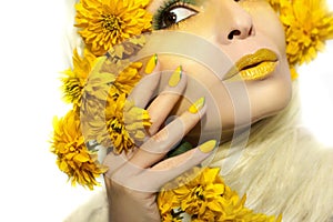 Yellow makeup and manicure.