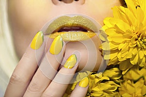 Yellow makeup and manicure.