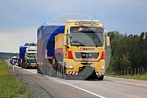 Yellow MAN V8 Semi Leads Wide Load Convoy