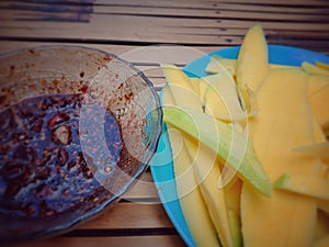 Yellow mango with chilli dip