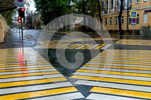 Yellow marking of pedestrian crossings at the intersection. Diagonal marking of a pedestrian crosswalk