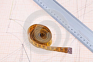 Yellow measure tape and metal ruler