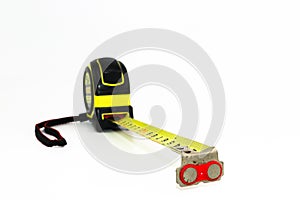 Yellow measuring tape with hand strap rope