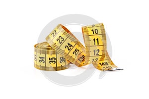 Yellow measuring tape isolated on white background. Measuring tape for fitness. Close up