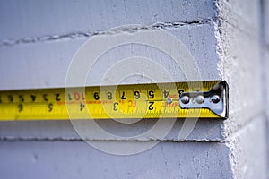 Yellow measuring tape. Measuring tape for construction works