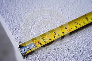 Yellow measuring tape. Measuring tape for construction works