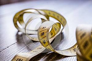 Yellow measuring tape of the tailor.