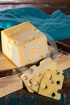 Yellow medium-hard mild Swiss cheese Emmental