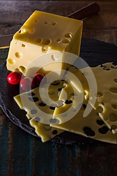 Yellow medium-hard mild Swiss cheese Emmental
