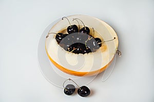 Compisition on white background with fruit. Melon, cherrys