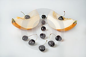Compisition on white background with fruit. Melon and cherrys