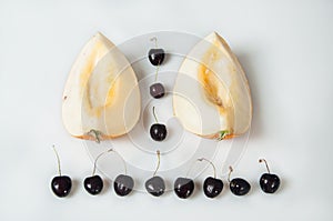 Compisition on white background with fruit. Melon and cherrys