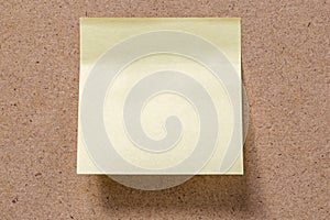 yellow memory note sticked to brown memory board