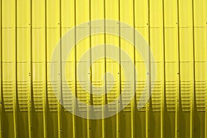 yellow metal sheet pattern and vertical line design