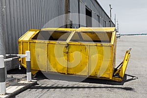Yellow metal waste skip