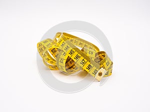 Yellow metric measuring tape on white background