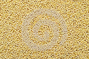 Yellow millet grain texture background, Food ingredient