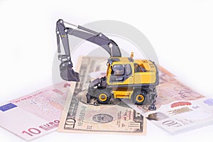 Yellow miniature excavator. rental of construction equipment