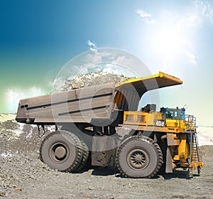 Yellow mining trucks photo