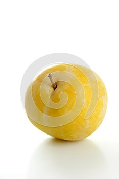 Yellow Mirabelles on white background