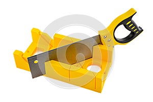 Yellow miter box and hand saw