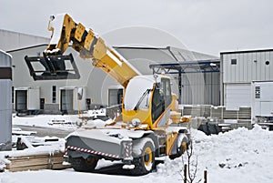 Yellow mobile crane.