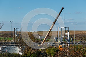 Yellow mobile crane on a construction site