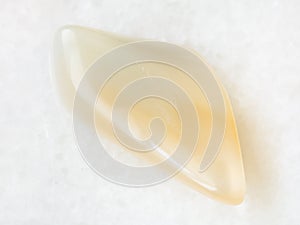 yellow moonstone (adularia) gemstone on white