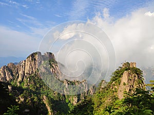 Yellow mountain in the clouds photo