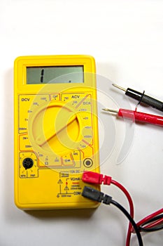 Yellow multimeter with its open circuit test needles