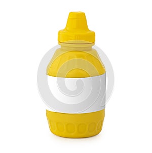 A yellow mustard bottle with blank label against a white background